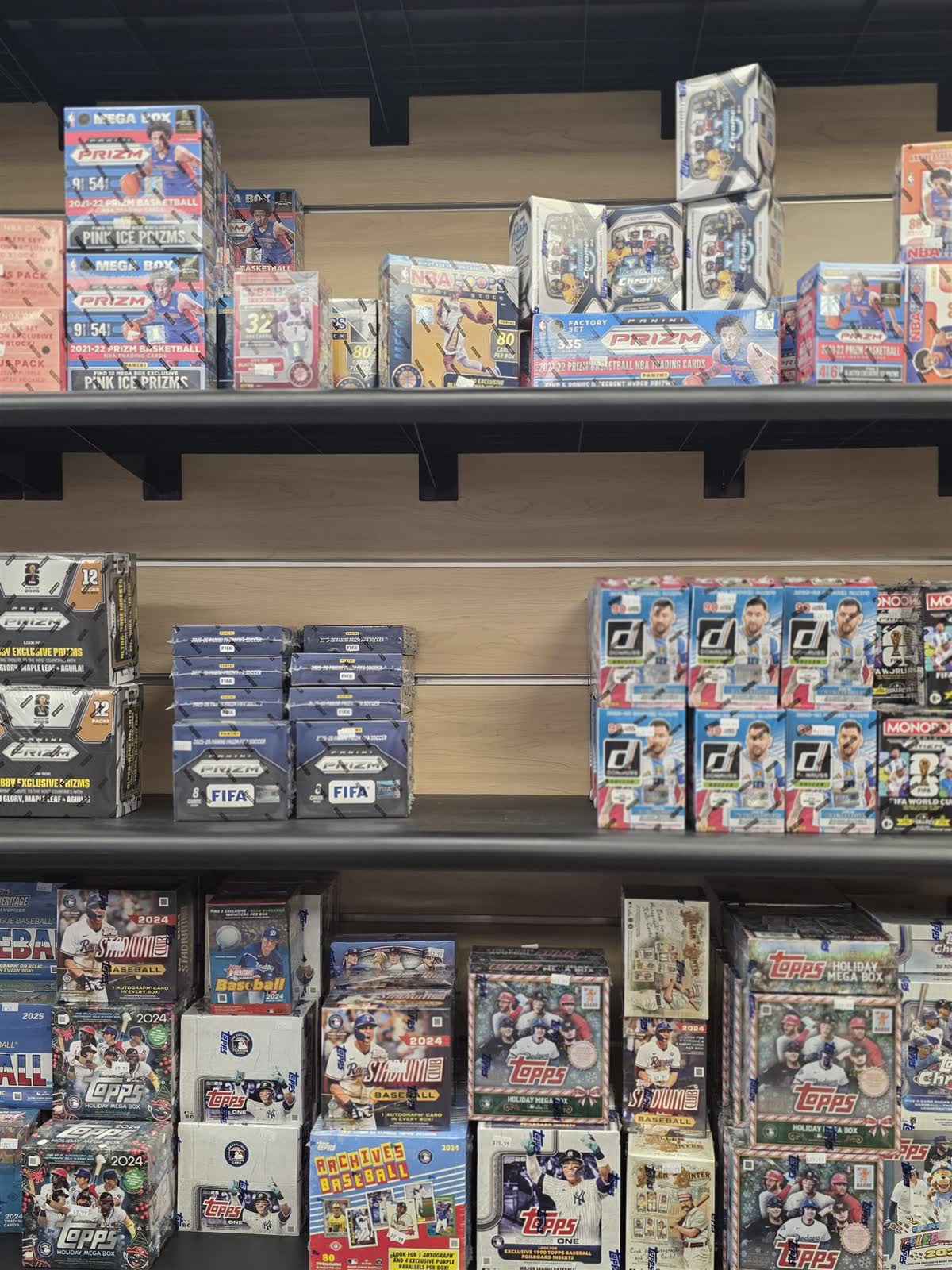 Shelves of sealed sports card boxes at GG Hobby